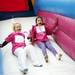 Two girls enjoy a ride on the blow up slide on Sunday. Daniel Brenner I AnnArbor.com
